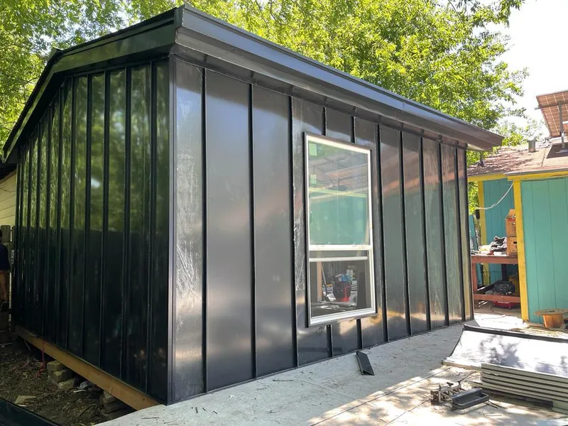 Black standing seam metal wall panels for Roof Inspection in Bexley